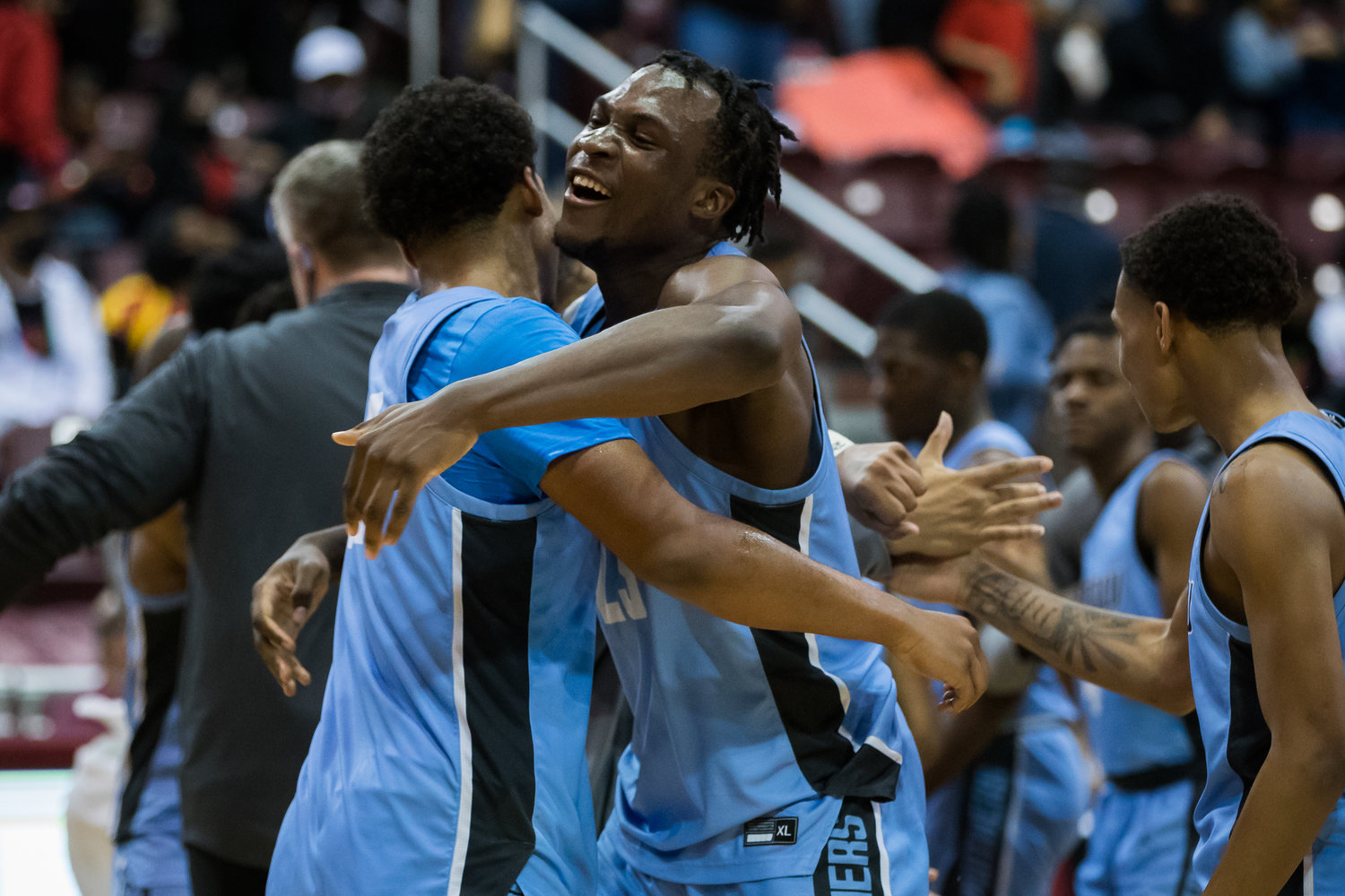 Paetow’s Everett Marlatt (22), left, and Charles Chukwu (23) celebrate the Panthers’ victory over Goose Creek Memorial in Tuesday’s Class 5A Region III semifinals at the Campbell Center in Houston.